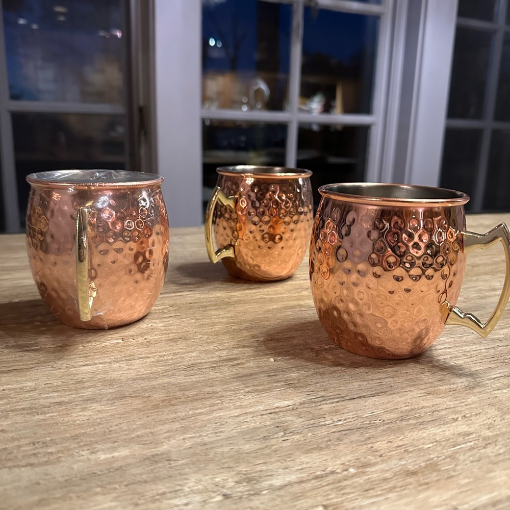 Hammered copper mugs.